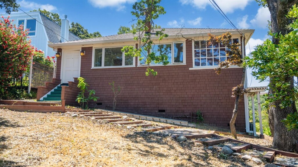 55 Manzanita Ave, Novato, CA 94945 - view of front of house with crawl space, stairs, and a vegetable garden