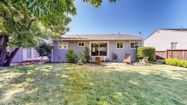 rear view of house featuring stucco siding and a patio