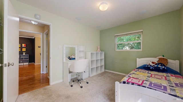 carpeted bedroom with baseboards