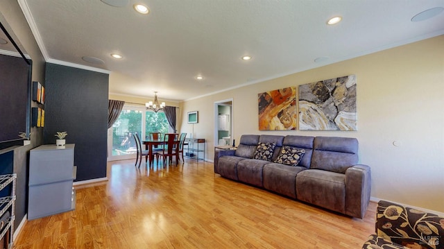living area with crown molding, a chandelier, light wood-style floors, recessed lighting, and baseboards