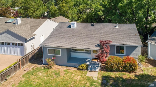 view of front of property with stucco siding and a chimney