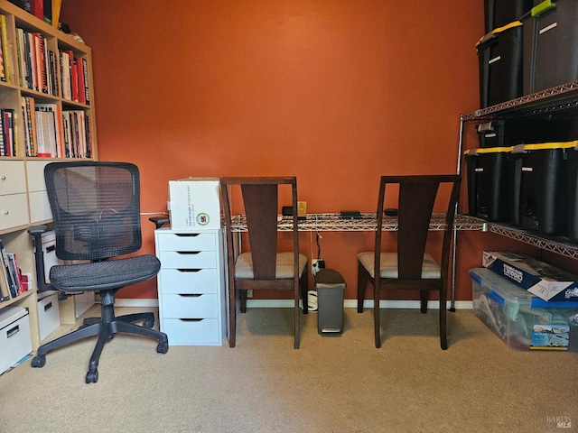carpeted home office with baseboards