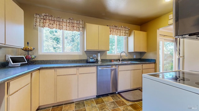 kitchen with dishwasher, electric range, a sink, and dark countertops