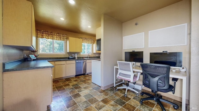 kitchen featuring dishwasher, dark countertops, dark stone finish flooring, recessed lighting, and a desk