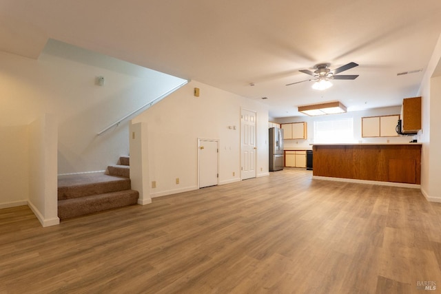 1132 Pear Tree Ln, Napa, CA 94558 - unfurnished living room with a ceiling fan, light wood finished floors, stairs, and baseboards
