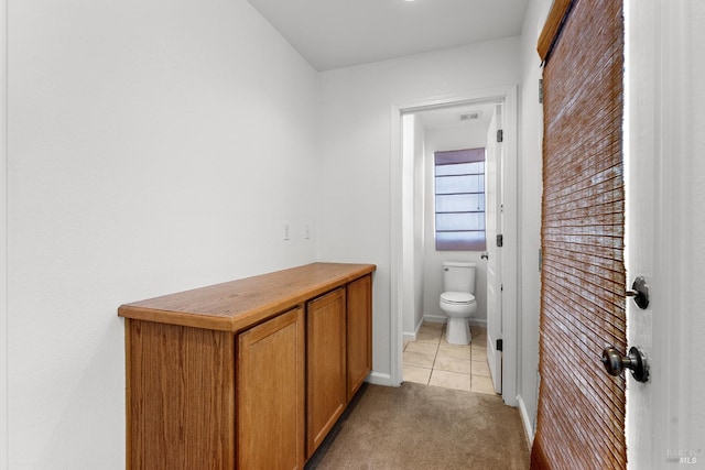 1049 Villaggio Cir, Vacaville, CA 95688 - bathroom featuring toilet, tile patterned floors, and baseboards
