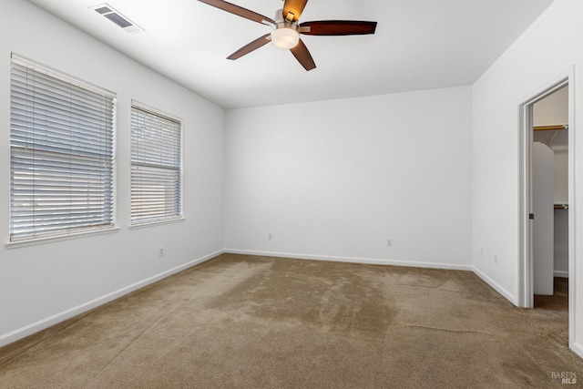 1049 Villaggio Cir, Vacaville, CA 95688 - unfurnished bedroom featuring a spacious closet, carpet flooring, baseboards, and a ceiling fan