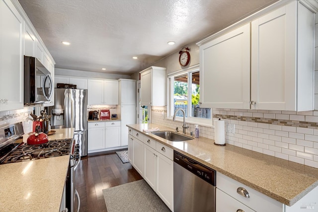 1805 Central Ave, Napa, CA 94558 - kitchen with appliances with stainless steel finishes, a sink, tasteful backsplash, white cabinets, and light stone countertops