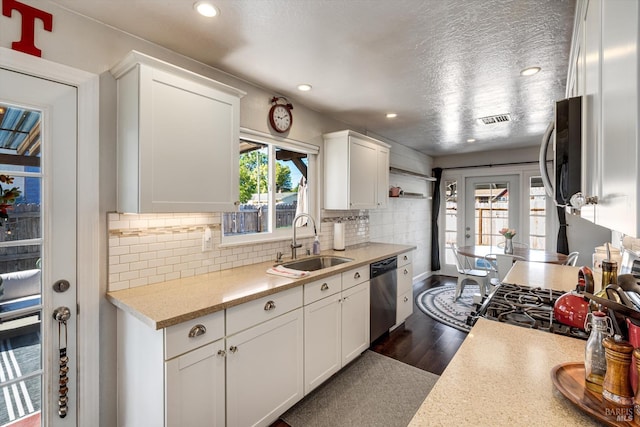 1805 Central Ave, Napa, CA 94558 - kitchen with a sink, dishwasher, light countertops, white cabinets, and backsplash