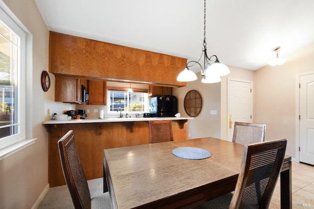 226 Usher Dr, Windsor, CA 95492 - dining area with a chandelier, light tile patterned floors, and baseboards