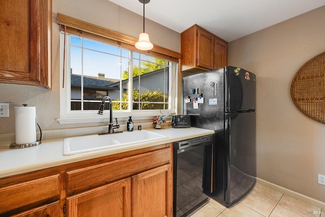 226 Usher Dr, Windsor, CA 95492 - kitchen featuring black appliances, a sink, brown cabinetry, light tile patterned floors, and light countertops
