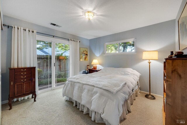 226 Usher Dr, Windsor, CA 95492 - bedroom featuring light carpet, access to outside, multiple windows, and baseboards