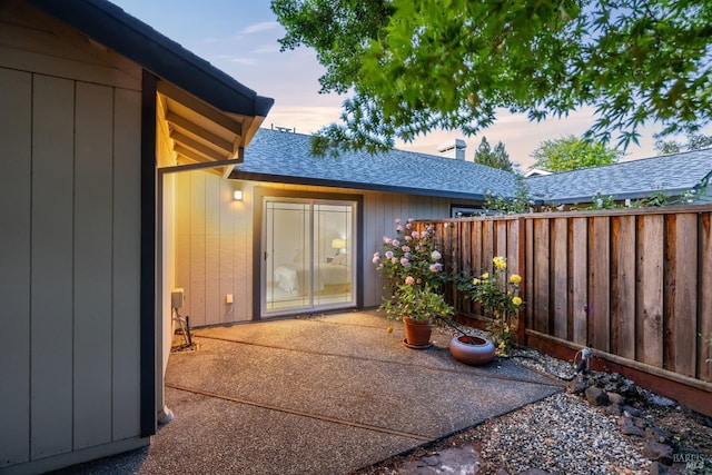 226 Usher Dr, Windsor, CA 95492 - entrance to property featuring a shingled roof, fence, and a patio area