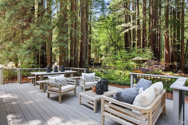 711 Furlong Rd, Sebastopol, CA 95472 - deck with an outdoor living space, outdoor dining space, and a wooded view