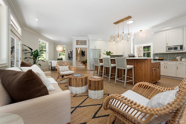 711 Furlong Rd, Sebastopol, CA 95472 - living room featuring plenty of natural light, ornamental molding, recessed lighting, and light wood-type flooring