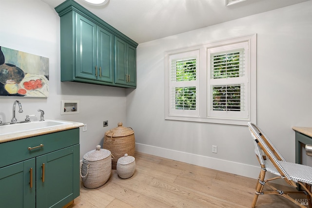 711 Furlong Rd, Sebastopol, CA 95472 - clothes washing area featuring hookup for an electric dryer, cabinet space, washer hookup, wood finished floors, and baseboards