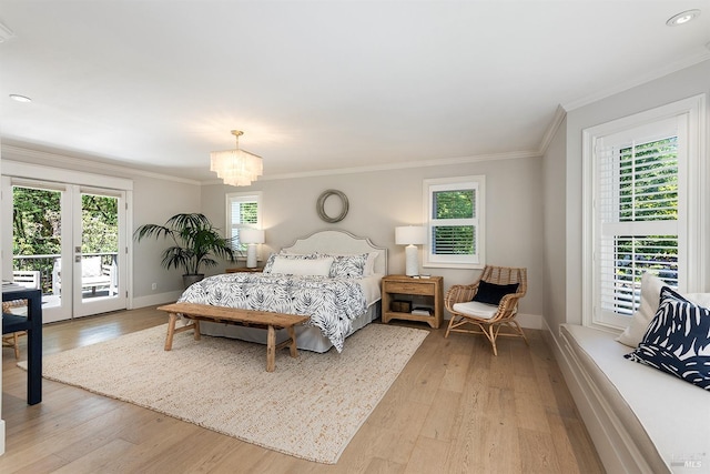 711 Furlong Rd, Sebastopol, CA 95472 - bedroom with access to outside, ornamental molding, baseboards, light wood-style flooring, and a chandelier