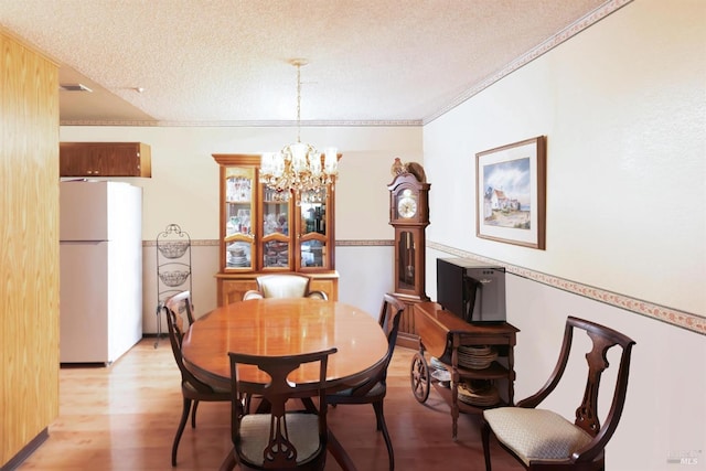 1444 Gold Way, Rohnert Park, CA 94928 - dining room with a chandelier, light wood finished floors, and a textured ceiling