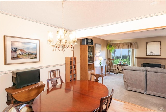 1444 Gold Way, Rohnert Park, CA 94928 - dining space featuring a chandelier and a brick fireplace