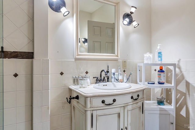 bathroom with tile walls and vanity