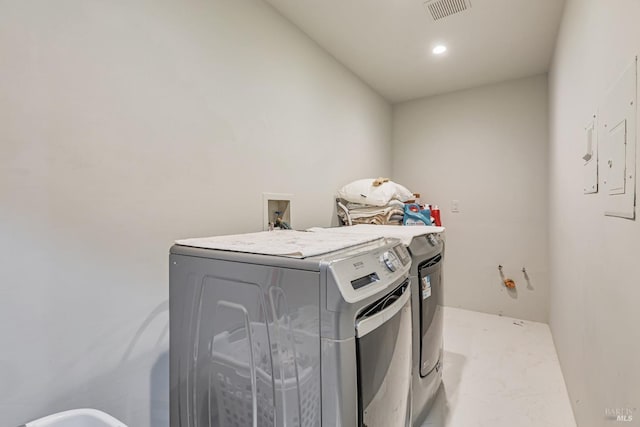 washroom featuring independent washer and dryer and recessed lighting