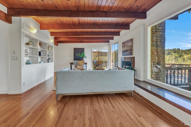4444 Redwood Rd, Napa, CA 94558 - living area with wood finished floors, wood ceiling, a fireplace, baseboards, and beamed ceiling