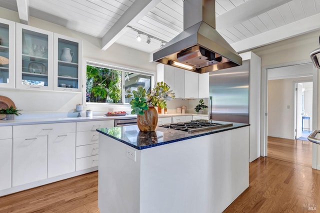 4444 Redwood Rd, Napa, CA 94558 - kitchen featuring island range hood, stainless steel gas cooktop, beamed ceiling, white cabinetry, and a center island