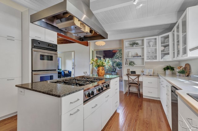 4444 Redwood Rd, Napa, CA 94558 - kitchen with appliances with stainless steel finishes, wall chimney range hood, light wood-type flooring, beam ceiling, and white cabinets