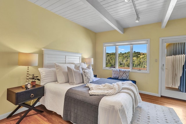 4444 Redwood Rd, Napa, CA 94558 - bedroom with beamed ceiling, wood finished floors, baseboards, access to outside, and track lighting