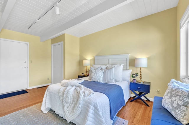 4444 Redwood Rd, Napa, CA 94558 - bedroom with baseboards, wood finished floors, track lighting, and beamed ceiling