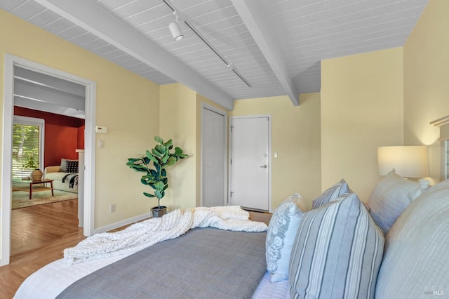 4444 Redwood Rd, Napa, CA 94558 - bedroom with wood finished floors, beam ceiling, baseboards, and track lighting