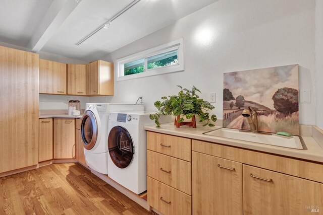 4444 Redwood Rd, Napa, CA 94558 - laundry area featuring washing machine and clothes dryer, cabinet space, light wood-type flooring, and rail lighting