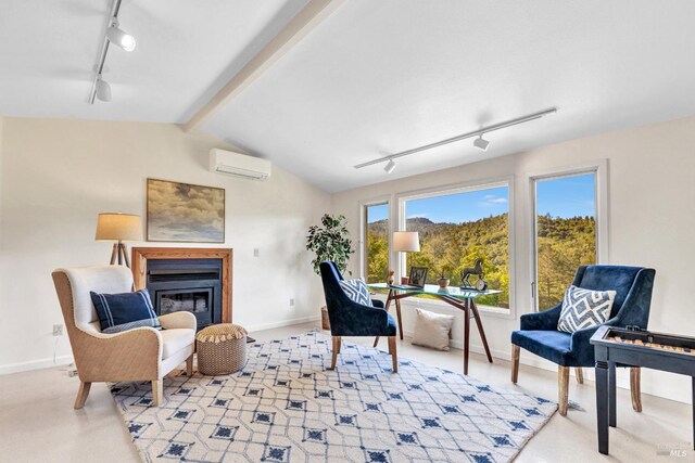 4444 Redwood Rd, Napa, CA 94558 - sitting room with rail lighting, a wall mounted air conditioner, a glass covered fireplace, and baseboards