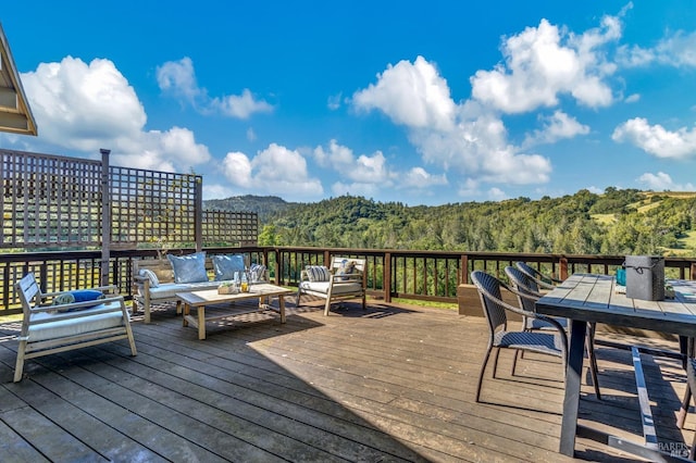 4444 Redwood Rd, Napa, CA 94558 - wooden deck featuring an outdoor living space, a wooded view, and outdoor dining area