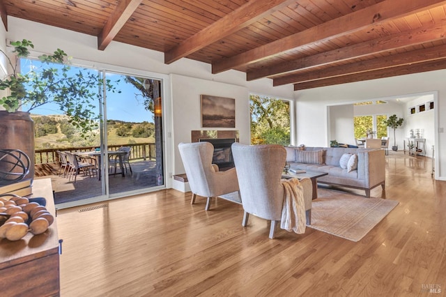 4444 Redwood Rd, Napa, CA 94558 - living area featuring wooden ceiling, wood finished floors, beam ceiling, a fireplace, and baseboards