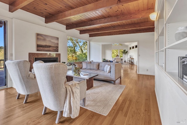4444 Redwood Rd, Napa, CA 94558 - living room with wooden ceiling, light wood-type flooring, a fireplace, beamed ceiling, and baseboards