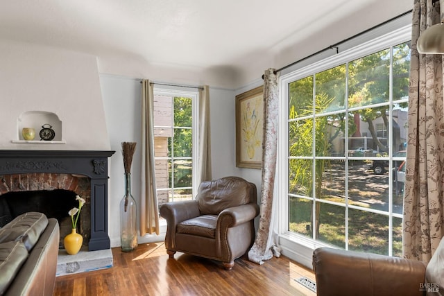 32 Muller St, Vallejo, CA 94590 - sitting room with wood finished floors and a fireplace