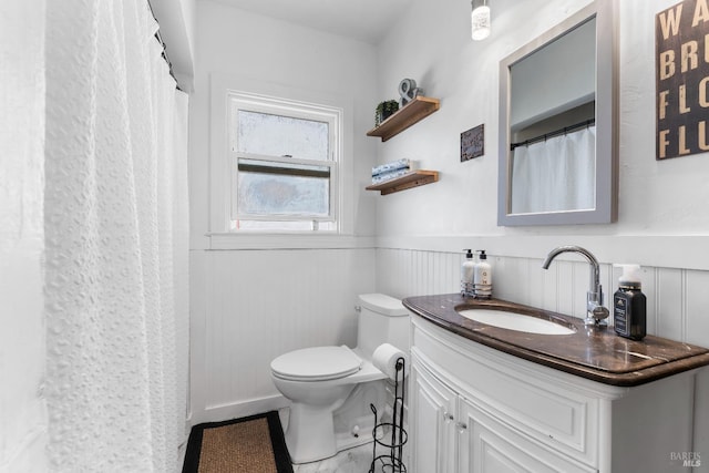 32 Muller St, Vallejo, CA 94590 - full bath featuring toilet, a wainscoted wall, and vanity