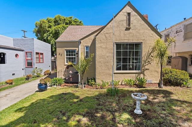 32 Muller St, Vallejo, CA 94590 - view of front of house with stucco siding, a front lawn, and a chimney