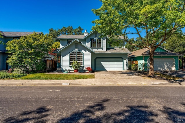 9227 Berwyn Way, Windsor, CA 95492 - traditional-style house with an attached garage, a chimney, fence, and driveway
