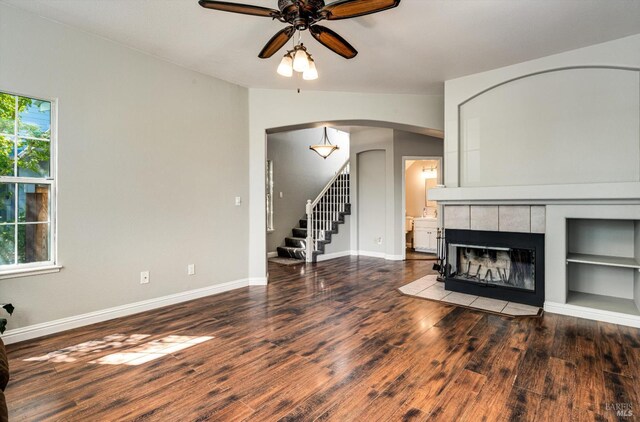 9227 Berwyn Way, Windsor, CA 95492 - living area with wood finished floors, a ceiling fan, stairway, arched walkways, and baseboards