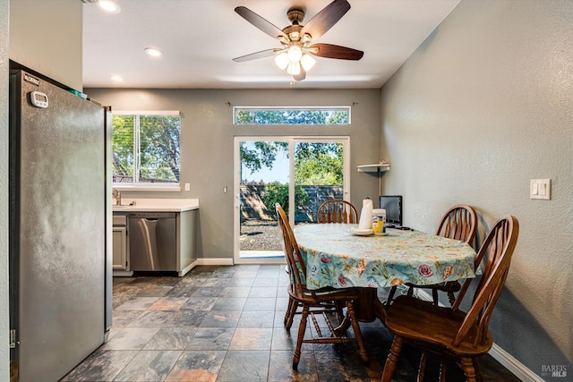 9227 Berwyn Way, Windsor, CA 95492 - dining room featuring baseboards, a ceiling fan, a textured wall, and dark stone finish floors