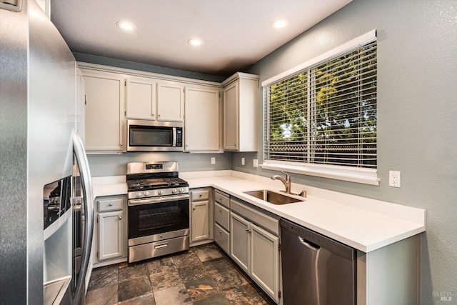 9227 Berwyn Way, Windsor, CA 95492 - kitchen with appliances with stainless steel finishes, a sink, recessed lighting, light countertops, and stone finish floors