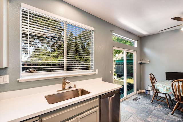 9227 Berwyn Way, Windsor, CA 95492 - kitchen featuring stainless steel dishwasher, a sink, a ceiling fan, light countertops, and stone finish flooring