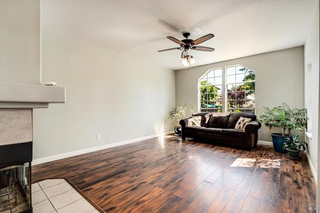 9227 Berwyn Way, Windsor, CA 95492 - living room with a multi sided fireplace, wood finished floors, ceiling fan, and baseboards