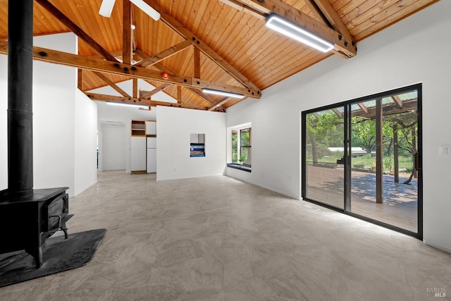 17651 Van Arsdale Rd, Potter Valley, CA 95469 - unfurnished living room featuring high vaulted ceiling, wood ceiling, beam ceiling, a wood stove, and ceiling fan