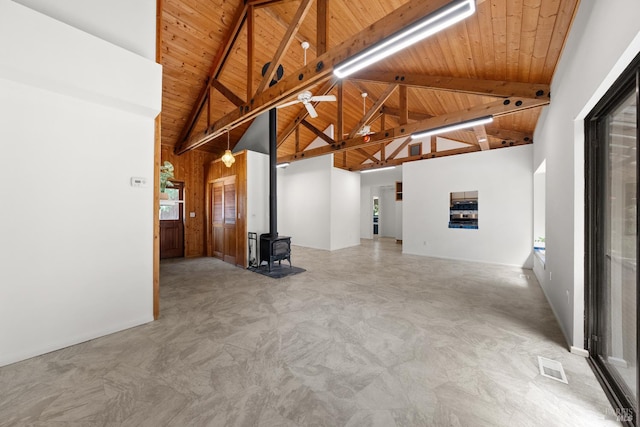 17651 Van Arsdale Rd, Potter Valley, CA 95469 - unfurnished living room featuring high vaulted ceiling, a wood stove, wooden ceiling, and beam ceiling