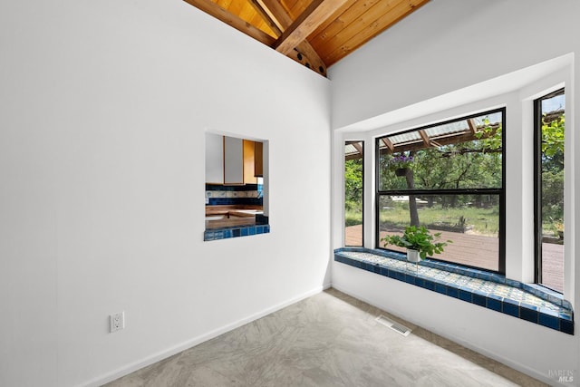 17651 Van Arsdale Rd, Potter Valley, CA 95469 - spare room featuring wooden ceiling, beam ceiling, baseboards, and high vaulted ceiling