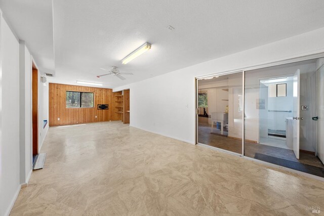 17651 Van Arsdale Rd, Potter Valley, CA 95469 - spare room with a ceiling fan, baseboards, and wooden walls