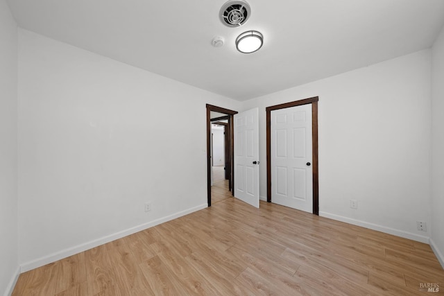 17651 Van Arsdale Rd, Potter Valley, CA 95469 - unfurnished room with light wood-style flooring, baseboards, and a smoke detector